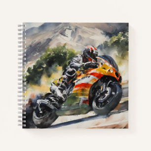 Motorbike cornering up a mountainside notebook