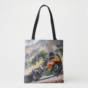 Motorbike cornering up a mountainside tote bag