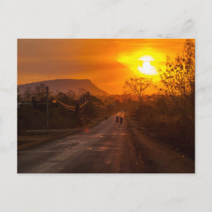Motorbiking in sunset postcard