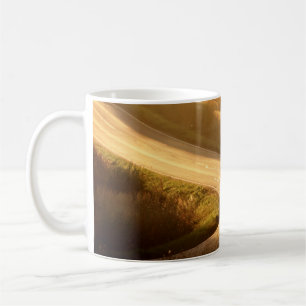 Motorcycle on countryside road at autumn evening.  coffee mug