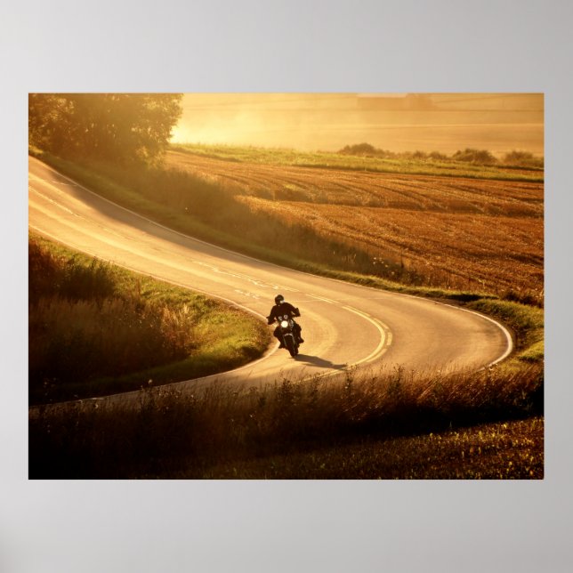 Motorcycle on countryside road at autumn evening.  poster (Front)