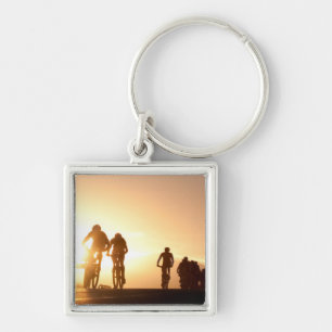 Mountain Bike Riders Make Their Way Over The Top Key Ring