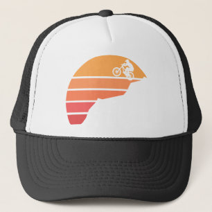 Mountain biking in the susnset trucker hat