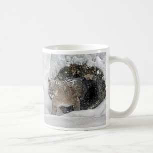 Mountain lion in snow coffee mug