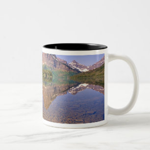 Mountains reflect into calm Two Medicine Lake in Two-Tone Coffee Mug
