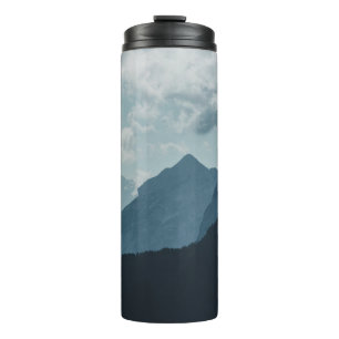 MOUNTAINS UNDER WHITE SKY THERMAL TUMBLER