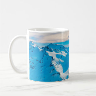 Mountains with snow peaks and sunset skysnow,alpin coffee mug