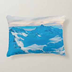 Mountains with snow peaks and sunset skysnow,alpin decorative cushion
