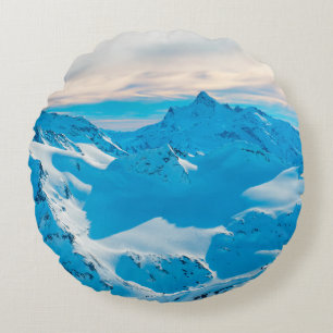 Mountains with snow peaks and sunset skysnow,alpin round cushion