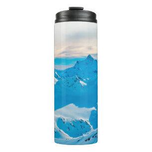 Mountains with snow peaks and sunset skysnow,alpin thermal tumbler