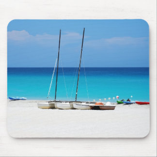 Mousepads with a picture of boats on a beach