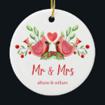 Mr and Mrs Cardinal Lovebirds Personalised Ceramic Ornament<br><div class="desc">Decorate your tree with this "Mr and Mrs" design, featuring a pretty watercolor of two red cardinals. The lovebirds are face to face, perched on seasonal evergreens with a heart in between them. Underneath "Mr and Mrs" is written in fun modern typography and you can personalise with the couple's first...</div>