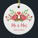 Mr and Mrs Cardinal Lovebirds Personalised Ceramic Ornament<br><div class="desc">Decorate your tree with this "Mr and Mrs" design, featuring a pretty watercolor of two red cardinals. The lovebirds are face to face, perched on seasonal evergreens with a heart in between them. Underneath "Mr and Mrs" is written in fun modern typography and you can personalise with the couple's first...</div>