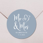 Mr Mrs Dusty Blue Wedding Classic Round Sticker<br><div class="desc">A chic dusty blue sticker for your wedding correspondence and party favours featuring "Mr & Mrs" in an elegant white script and a white illustration of two hearts joined together. Add your name and wedding date.</div>