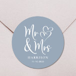 Mr Mrs Dusty Dusty Blue Wedding Classic Round Sticker<br><div class="desc">A chic dusty blue sticker for your wedding correspondence and party favours featuring "Mr & Mrs" in an elegant white script and a white illustration of two hearts joined together. Add your name and wedding date.</div>