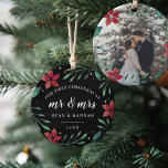 Mr. & Mrs. | First Married Christmas Photo Ceramic Ornament<br><div class="desc">Celebrate your first Christmas as a married couple with this charming and festive ornament. Design features "our first Christmas as Mr. & Mrs." and the year in white lettering, surrounded by red poinsettia flowers and green holiday foliage on a rich black background. Add a photo to the back with matching...</div>