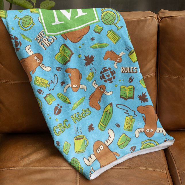 Mr. Orlando Pattern Monogram Fleece Blanket (Blanket folded over couch)