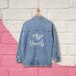 Mrs brides name white typography and heart wedding denim jacket<br><div class="desc">This trendy and stylish denim jacket, which can be personalised to proudly display the title "Mrs." followed by the last name of the just married woman, and adorned with a lovely white heart design in an elegant script font, serves as an ideal and exquisite accessory for any bride to wear...</div>