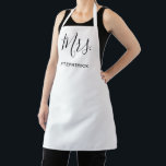 Mrs Last Name White Simple Wedding Bride Newlywed Apron<br><div class="desc">Simple apron with "Mrs." in an elegant script along with your last name in black over a white background.  This modern apron makes a great wedding gift for a bride.</div>