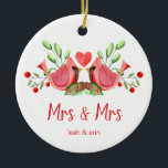 Mrs & Mrs Cardinal Lovebirds Personalized Ceramic Ornament<br><div class="desc">Decorate your tree with this "Mrs & Mrs" design, featuring a pretty watercolor of two red cardinals. The lovebirds are face to face, perched on seasonal evergreens with a heart in between them. Underneath "Mrs and Mrs" is written in fun modern typography and you can personalize with the couple's first...</div>