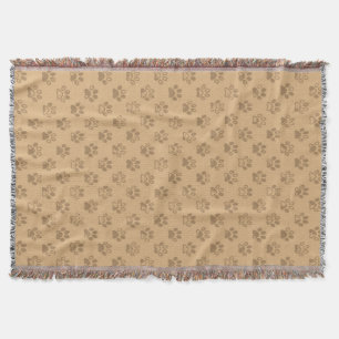 Muddy paw prints in beige and brown throw blanket