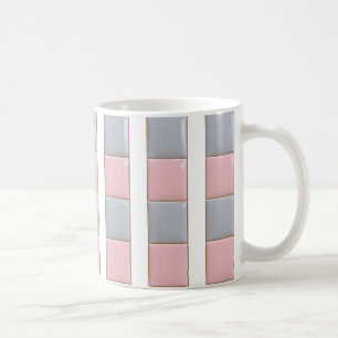 Mug decorated with pastel colored tiles.