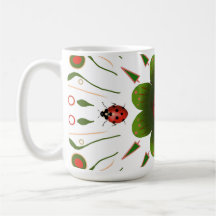 Mug with ladybug design, red & green on white.