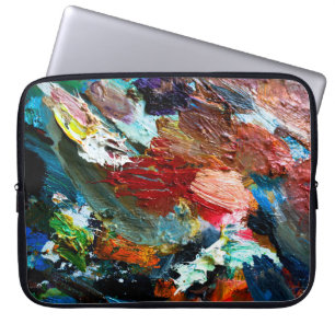 multi-colored strokes of oil paint on the artist's laptop sleeve