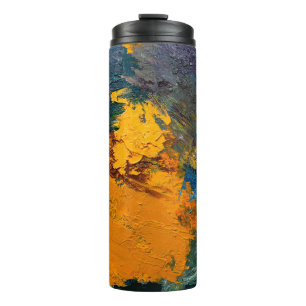 multi-colored strokes of oil paint on the artist's thermal tumbler