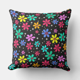 Multi-coloured daisies on a black background cushion