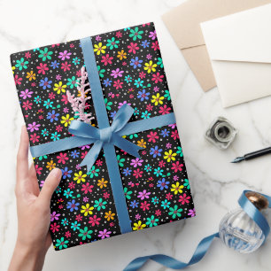 Multi-coloured daisies on a black background  wrapping paper