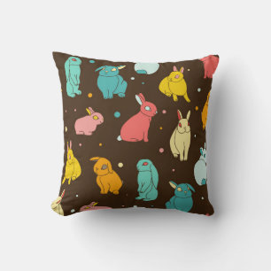 Multi-coloured, different rabbits, hares on a dark cushion