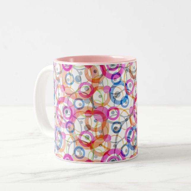 Multi-coloured polka dots, circles on a white Two-Tone coffee mug (Front Left)