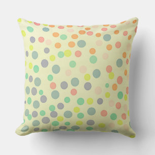 Multicolor pastel dots on pastel yellow cushion