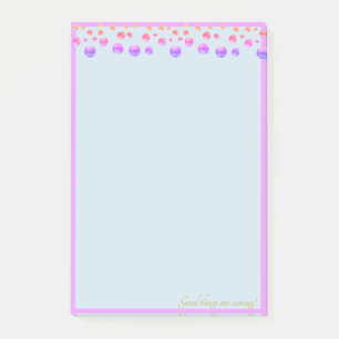Multicolored confetti on light blue post-it notes