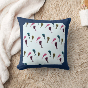 Multicolored handmade seahorses in blue ocean cushion
