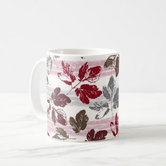 Multicolored leaves on a striped background. coffee mug