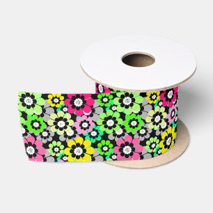 Multicolored paper cut flowers on black background satin ribbon