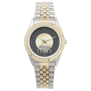 Mum and baby elephant in the setting sun watch