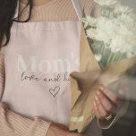 Mum’s Love & Hugs Pink | Cute Mother’s Day Gift Apron<br><div class="desc">Let Mum cook, bake, or grill in style with this "Mum’s Love & Hugs" pink apron! Designed with love, this charming and practical apron is perfect for moms who bring warmth and joy to the kitchen. The soft pastel pink design adds a sweet and elegant touch, making it a thoughtful...</div>