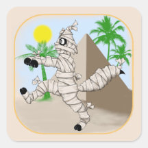 mummy cat walking past the pyramid