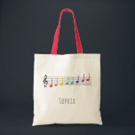 Music Lesson Rainbow Notes Children Tote Bag<br><div class="desc">This cute and fun musical custom name tote bag features a stave with rainbow music notes. It is perfect for your child to carry their music to piano, violin, or flute lessons. Customise it with your own details, and use the editing tool to make further adjustments such as font size...</div>