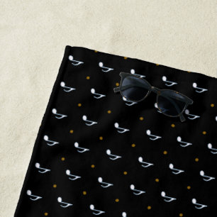 music notes on black beach towel