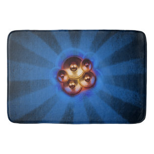 Music speakers and blue sunburst bath mat