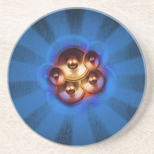 Music speakers and blue sunburst coaster