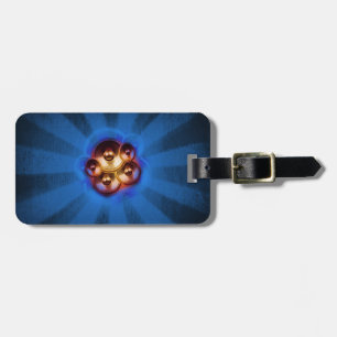 Music speakers and blue sunburst luggage tag