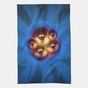 Music speakers and blue sunburst tea towel