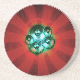 Music speakers and red sunburst coaster