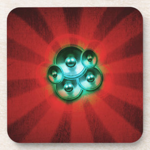 Music speakers and red sunburst coaster