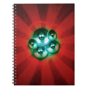 Music speakers and red sunburst notebook